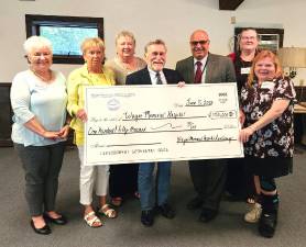 (L-R): Wayne Memorial Hospital Auxiliary President-Elect Joyce Malicky, Treasurer Diane Fox, President Diane Popovich, WMH/WMHS Board Chair Hugh Rechner, WMH CEO James Pettinato, Auxiliary Secretary Tami Baker, and Vice President Michelle Corrigan.