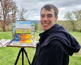 Artist Mitchell Saler with his landscape.