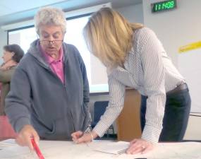 Delaware Township Supervisor Jane Neufeld went over the map with Tracey Vernon of Vernon Land Use, citing problems with local roads.