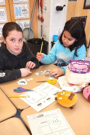 L-R: Students Annabella Marshall and Zara Hussain enjoy ‘pigeon pairings’ lesson.