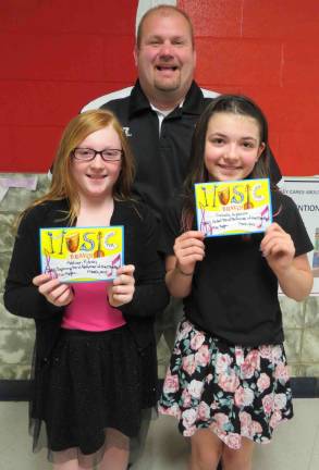 Band Students of the Month: Addison Kidney (Beginning Band) and Isabella Anderson (Cadet Band) with DVES Principal Aaron Weston.