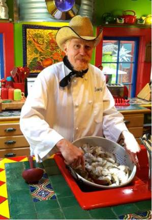 Cowboy Chef Doug Kosh of the Phoenix Store creating gourmet Cowpoke grub for the Black Bear Film Festival fundraiser in August. (Photo provided)