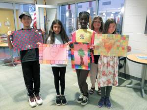 Delaware Valley Elementary School Autism Awareness contest winners (l-r) Chase Kurz, Zoe Bocaletti, Seiki Jones, and Caitlyn Feely with P.A.S.S. administrative assistant Wendy Ryan (in the rear).