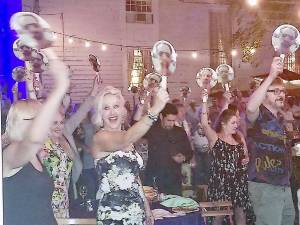 Handmade fans sporting a photo of Talent’s face were placed at each table