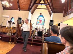 Dave Matsinko shows two Appalachian Mountain Dulcimers to audience at GHTA’s Lunch and Learn on April 18.