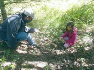 Ellie Aukeman, pictured with with instructor James Frye, explores mushrooms at PEEC for her nature journal. (Photo provided)