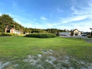 AutoZone is interested in developing land on Routes US 6 and 209 next to the Dollar General (right) On the left is the building currently on the property.