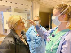 Health care workers at Wayne Memorial Hospital in Honesdale conduct screenings at entry.