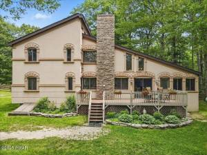 Custom stucco home with pond view and more