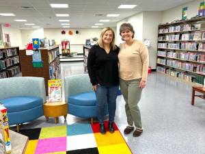Stacey Krauss stands next to Rose Chiocchi in the Children’s Room.