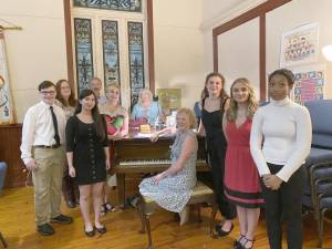Musical director Sandy Stalter (at piano) with some of the “Broadway Babies” cast