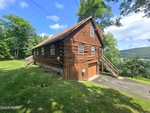 Riverfront Log Cabin with Endless Potential