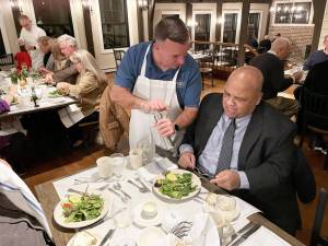 Manny Tirado being served by state Assemblyman Karl Branenec. Photo by Peter Lyons Hall.