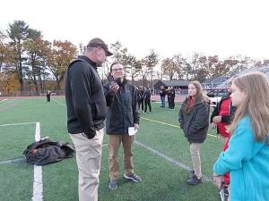 Coach Keith Olsommer being interviewed by Jake Graziano as DVE-News/TV reporters shadow the interview.