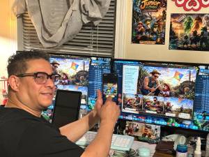 Mariano Cortes shows off his new game Junior el Coquí Puerto Rican cultural adventure game.