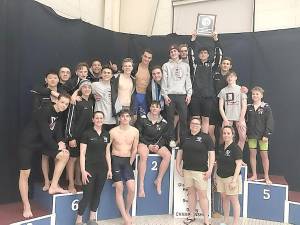 The boys on the podium with the district plaque (Photo provided)