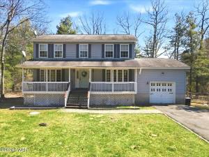 Enjoy country living and lake access in a spacious four-bedroom home