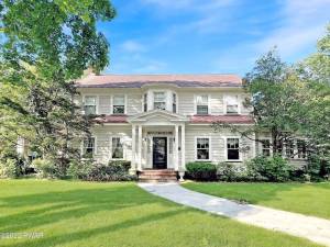 Prominent 4-bedroom Dutch colonial in the heart of Milford has it all