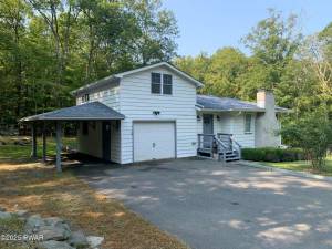 Walk to the lake from this home on a corner lot