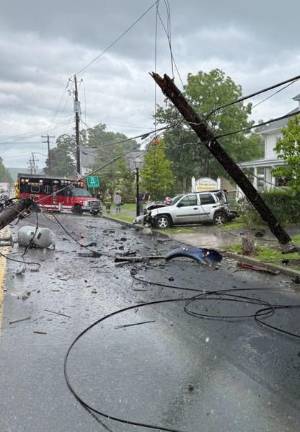 An out of control tractor trailer leaves a trail of destruction July 28 on West Hartford Street in Milford.