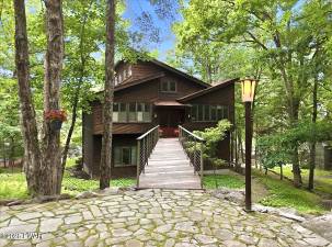 Lakefront luxury with private dock on one-plus acre