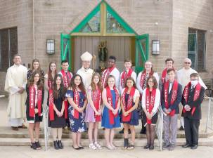 Bishop Bambera is pictured here with the Confirmation candidates just before the celebration of the Eucharistic Liturgy and Confirmation ceremony. Looking on are Father Joseph Manarchuck, Pastor, and Deacon Thomas Spataro (Photo by Jay A. Asper)