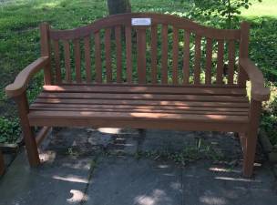 One of the 14 benches and six chairs refinished by Councilwoman Maria Farrell and crew