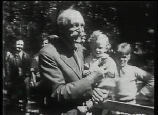 Gov. Gifford Pinchot enjoys a sweet treat with a child at his annual community ice cream social in the 1930s.