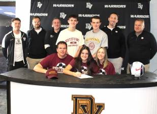 L-R Front Row: Jason Curabba, Regan Curabba, and Dawn Curabba. L-R Back Row: Head girls’ soccer coach Kevin Quinn, assistant soccer coaches Andy Rupp and Jeff Luhrs, brothers Quinn and Jack Curabba, and former soccer coaches Brian Sweeney and Jeff Rainear.