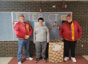 Marine Corp League Commandant Gary Brink, Rotary Interact President Aidyn Campbell, and Senior Vice Commandant Don Knight.