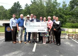 Rep. Bresnahan presents a check for $2 million in federal funding for State Route 6 repairs.