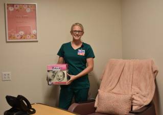 Brittany Kimble, RN, BSN, IBCLC, who provides lactation consultations for patients at Wayne Memorial Hospital and WMCHC, is shown standing in the hospital’s Lactation Room. The room is a special accommodation for employees who are lactating mothers and may be utilized for up to one year following the birth of their child. Provided photo.