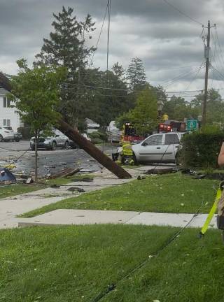 An out of control tractor trailer leaves a trail of destruction July 28 on West Hartford Street in Milford.