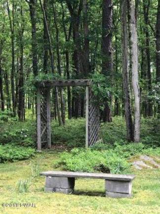 Enjoy woods and water in this two-story country farmhouse