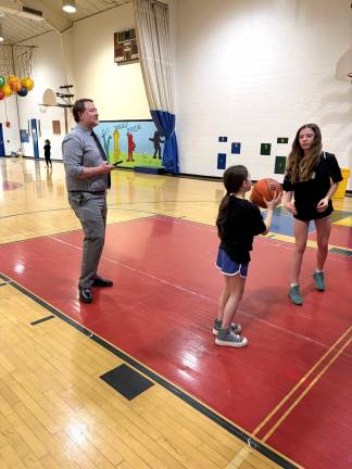 Pictured Jayson Pope, Delaware Valley Assistant Superintendant, his daughter Hazel and a DVES student.