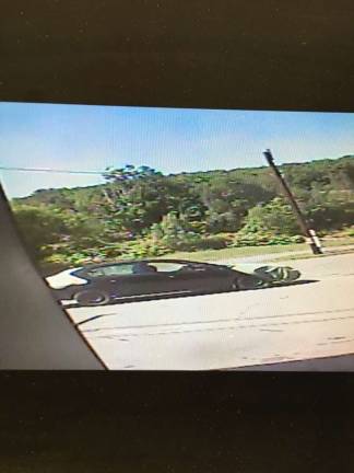 A security camera image shows the suspect's vehicle speeding away (Photo: Pennsylvania State Police)