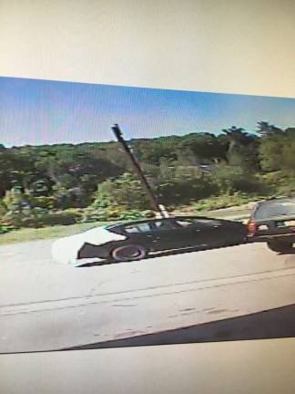 A security camera image shows the suspect's vehicle speeding away (Photo: Pennsylvania State Police)