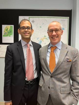 Anand Dash, left, and Neill Clark met at a planning board meeting, where Dash’s cross-examination of the developer’s engineer impressed Clark. The two lawyers, both long-distance runners, are now fast friends. Their “bromance... grows stronger every day,” said Dash.