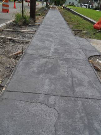 New library sidewalk to imitate bluestone without the problems inherent in using real stone. (Photo by Charles Reynolds)