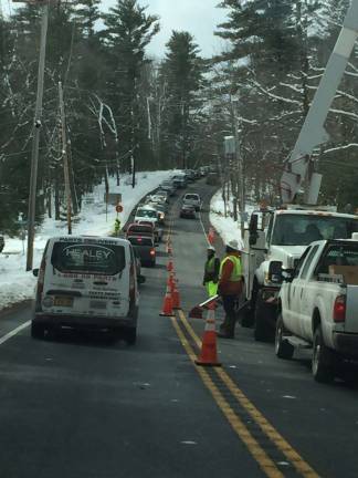 PCP&amp;L wasn't the only utility challenged by Winter Storm Riley. Route 2001 in Milford, pictured, was down to one lane last Thursday as much-needed repair work was still underway by crews for Met-Ed. The utility estimated 7,000 customers were still without power a week after the first storm. (Photo by Linda Fields)