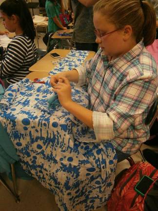 Nora Loicano and Alani Munoz make scarves (Photo provided)