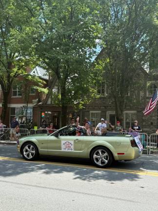 Grand Marshal Centa Quinn, accompanied by Family Members.