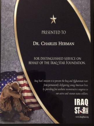The plaque presented to Dr. Herman.