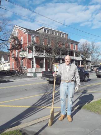 Bill Kiger with his broom (Photo by Linda Pinto)