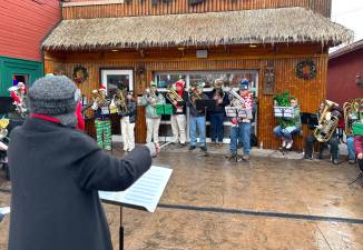 A few of the 40 musicians from the Tuba Concert Group as Betsy Krakowiak conducts.