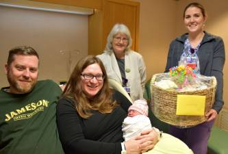 Pictured (from left): Dad Jameson, mom Sara holding Emilia, Pat Konzman, and Natasha Freethy (Photo provided)