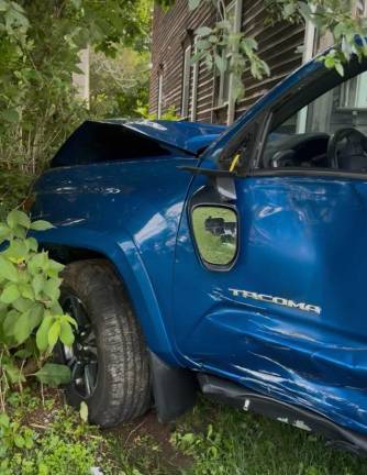 The Tacoma driven by Mark Strouse shows damage after the crash.