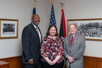 From left, ESU President Kenneth Lone,. Trustee Ainslee Green, COT Chair L. Patrick Ross