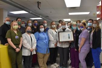 Wayne Memorial Hospital’s laboratory staff with the recently received College of American Pathologists re-accreditation.