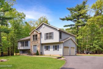 Large contemporary split-level has lake access